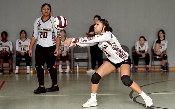 Baumholder's Alesia Delinois bumps the ball in the back row as fellow Buccaneer Leai Vaisagote watches during a match againt Spangdahlem on Sept. 28, 2024, at Baumholder High School in Baumholder, Germany.