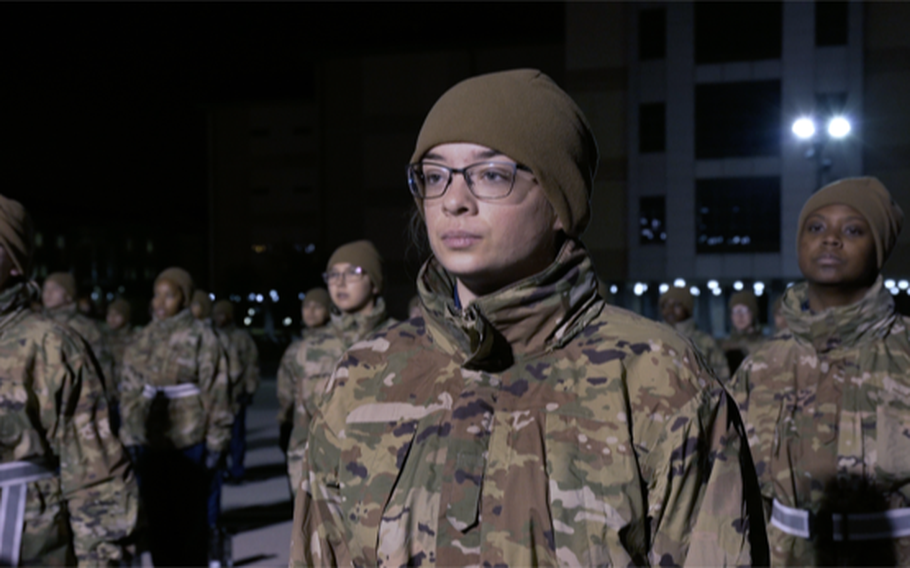 Trainee Emma Lollar prepares to sing the Air Force song before morning physical training during the filming of the docuseries “Basic,” which will stream on the Air Force Recruiting YouTube channel beginning Thursday. The eight-episode series follows Lollar and four other trainees who attended basic training at Joint Base San Antonio-Lackland, Texas, between October 2019 and January 2020. 