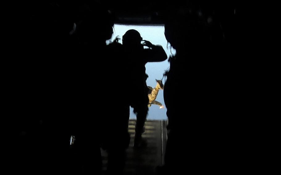 Members of the 31st Marine Expeditionary Unit's maritime raid force jump from an MV-22B Osprey while training over Ie Shima, Okinawa, Aug. 12, 2024. 