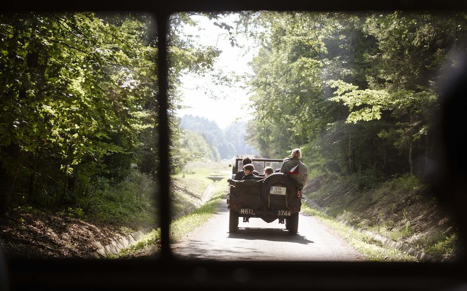 A Czech resident drives to a bomber crash site in an original World War II Jeep during the 80th commemoration of the Battle over the White Carpathians in the Czech Republic on Sept. 1, 2024.