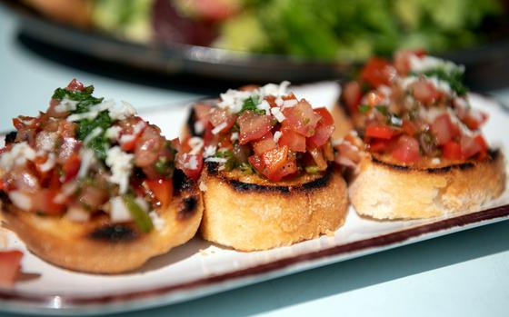 The bruschetta at Der Nudelmacher in Neustadt, Germany, is made with fresh tomato, onion and parmesan piled onto lightly toasted pieces of bread and covered with a basil dressing.