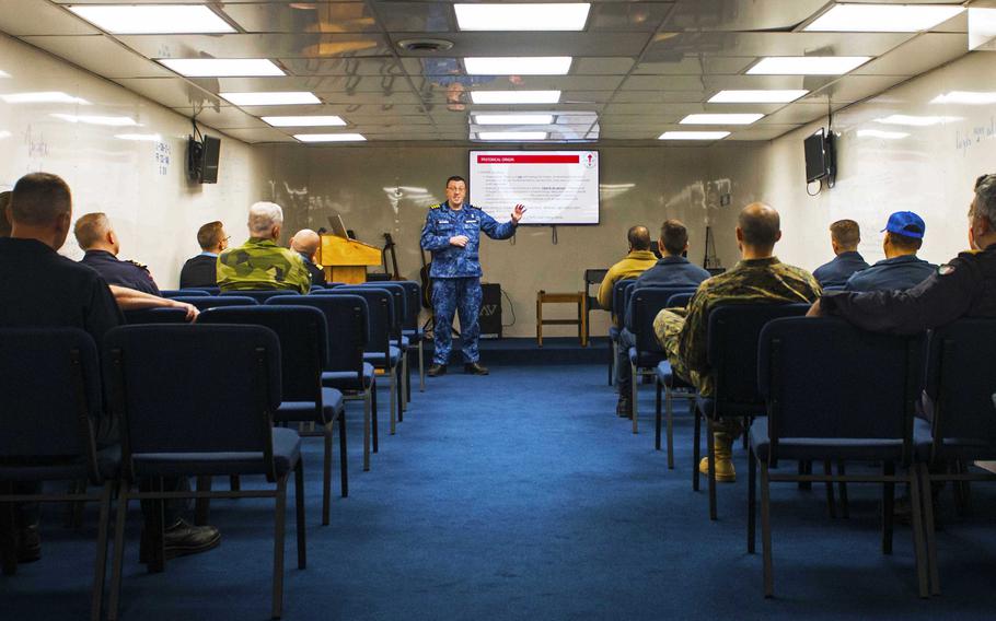 Belgian navy chaplain Emmanuel Reynaerts, a secular humanist, speaks to service members aboard USS Mount Whitney during Baltic Operations 2023. More than a dozen NATO chaplains are taking part in training to support service members during the U.S. Navy-led international exercise in the Baltic Sea. 