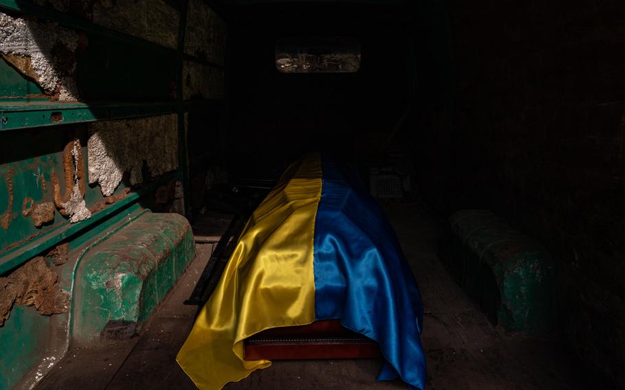 The casket of a Ukrainian soldier is seen inside a van after a military service in Odessa, Ukraine, on March 29, 2022.