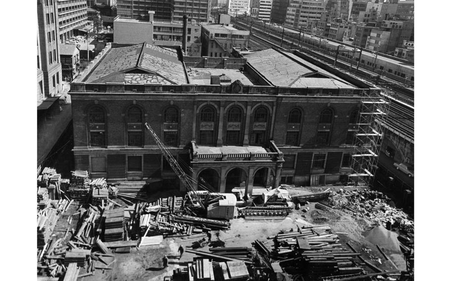 Wreckers prepare to tear down the former Rocker Four building in downtown Tokyo, which during the 1950s housed the biggest U.S. military club in the world. It would be replaced by a modern office building. 