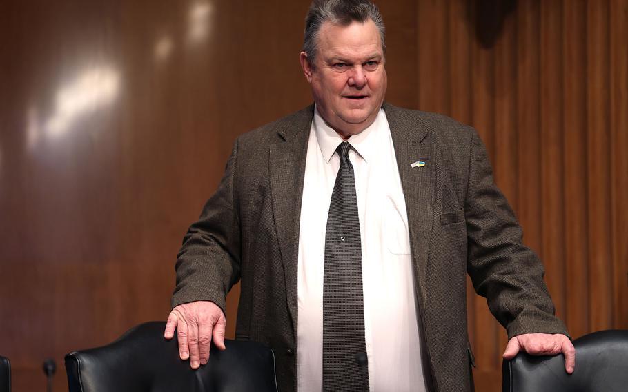 Jon Tester arrives for a Senate Banking, Housing, and Urban Affairs Committee hearing 