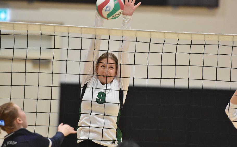 Naples' Anna Gose strains to block the ball Friday, Sept. 13, 2024, in the Wildcats' four-set loss to Black Forest Academy in Vicenza, Italy.