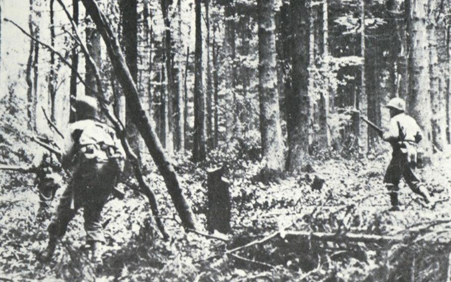 Soldiers of the 4th Infantry Division move through Huertgen Forest in late 1944. Martin Marty Sylvester, who is among a group of World War II veterans for the 80th anniversary of the landings, said some of his clearest and most painful memories come from the fighting in the German forest.