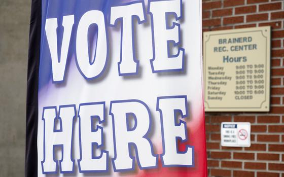 A "vote here" sign is seen at the Brainerd Youth and Family Development Center, Aug. 1, 2020, in Chattanooga, Tenn. Tennessee's top election office sent letters to more than 14,000 registered voters asking them to prove their citizenship, a move that alarmed voting rights advocates as possible intimidation. 