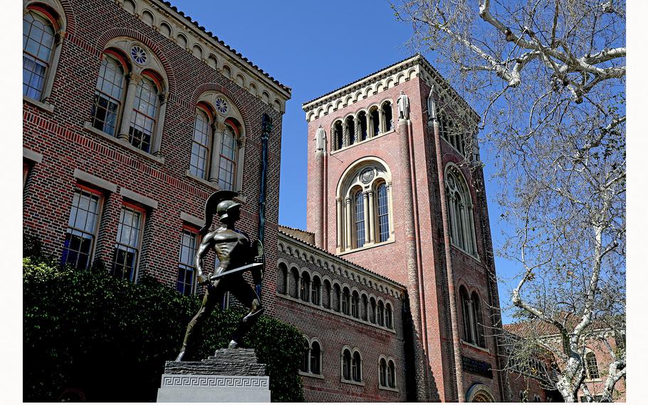 The Bovard Administration Building, with Tommy Trojan out front, on the campus of the University of Southern California is seen on March 28, 2023, in Los Angeles. 