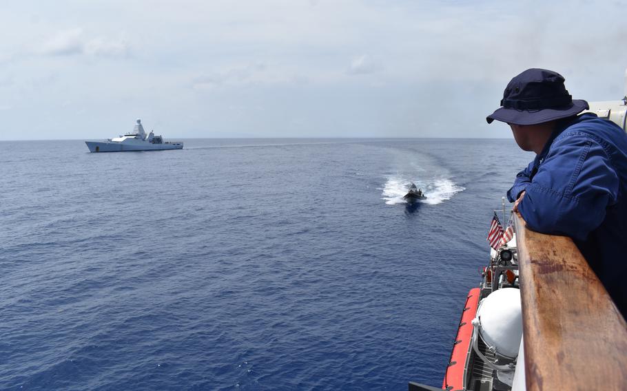 Cmdr. Mike Ross, commanding officer of Coast Guard Cutter Resolute (WMEC 620), oversees a bulk contraband transfer with the Royal Netherlands Navy HNMLS Groningen (P843) in the Caribbean Sea, May 20, 2024. 