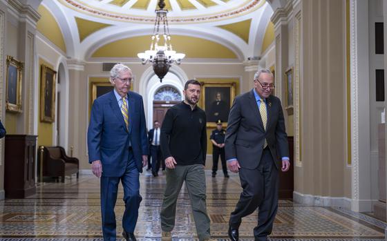 Ukrainian President Volodymyr Zelenskyy, center, walks with Senate Minority Leader Mitch McConnell, R-Ky., left, and Senate Majority Leader Chuck Schumer, D-N.Y., as he arrives for a briefing with lawmakers about the war effort against Russia, at the Capitol in Washington, Thursday, Sept. 26, 2024. (AP Photo/J. Scott Applewhite)