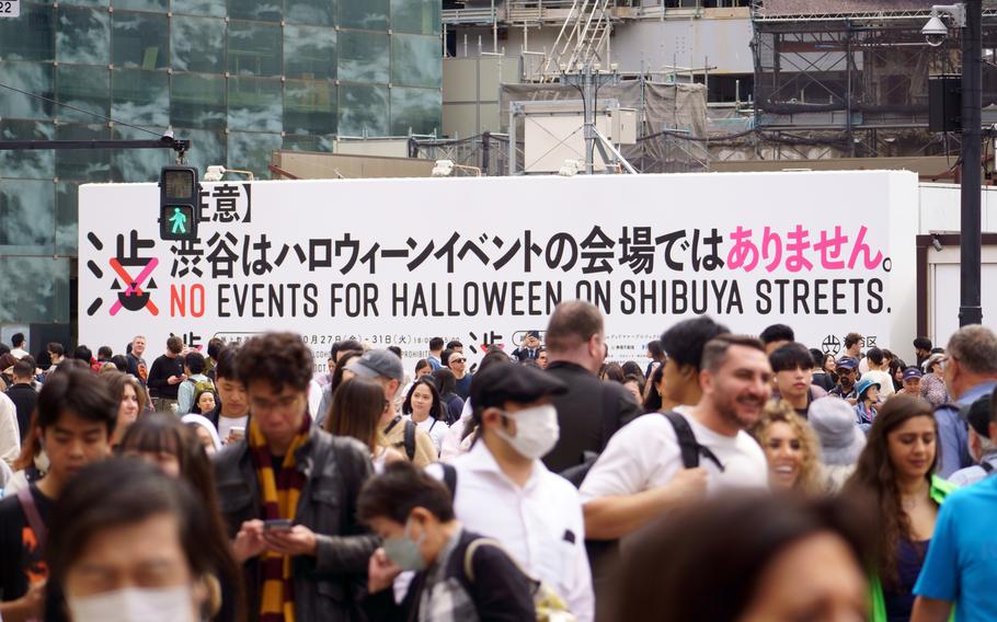 A billboard near Shibuya Station in Tokyo warns against unauthorized outdoor Halloween gatherings, Wednesday, Oct. 25, 2023. 