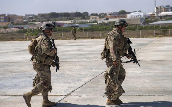 U.S. soldiers from the East African Response Force walk toward a C-130J Super Hercules Jan. 21, 2021, in Somalia. U.S. military officials are developing a proposal to send dozens of special operations troops back into Somalia, where security conditions have worsened in the months since nearly 700 troops were pulled out of the country, The New York Times reported Tuesday.

