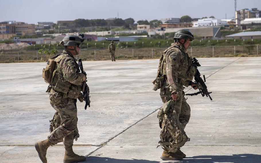 U.S. soldiers from the East African Response Force walk toward a C-130J Super Hercules Jan. 21, 2021, in Somalia. U.S. military officials are developing a proposal to send dozens of special operations troops back into Somalia, where security conditions have worsened in the months since nearly 700 troops were pulled out of the country, The New York Times reported Tuesday.