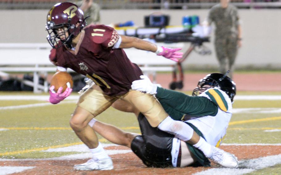 Matthew C. Perry's Kameron Ramos tries to elude Edgren tackler Cole Donnelly.