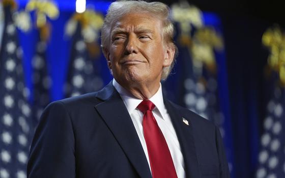 Republican presidential nominee former President Donald Trump arrives at an election night watch party at the Palm Beach Convention Center, Wednesday, Nov. 6, 2024, in West Palm Beach, Fla. (AP Photo/Evan Vucci)