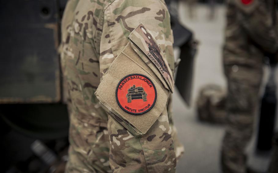 A Danish service member displays a  tank team unit patch.