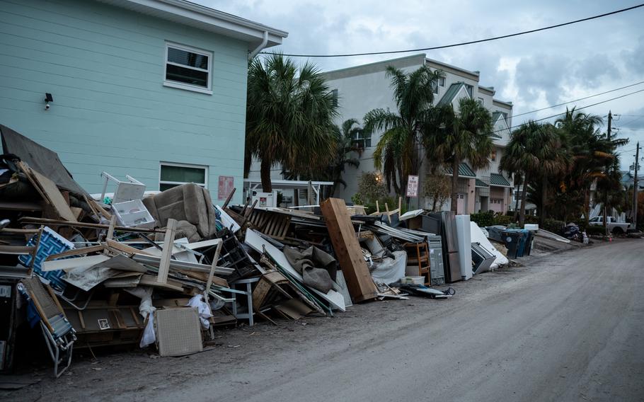 Damaged belongings outside an apartment building in Treasure Island, Fla.