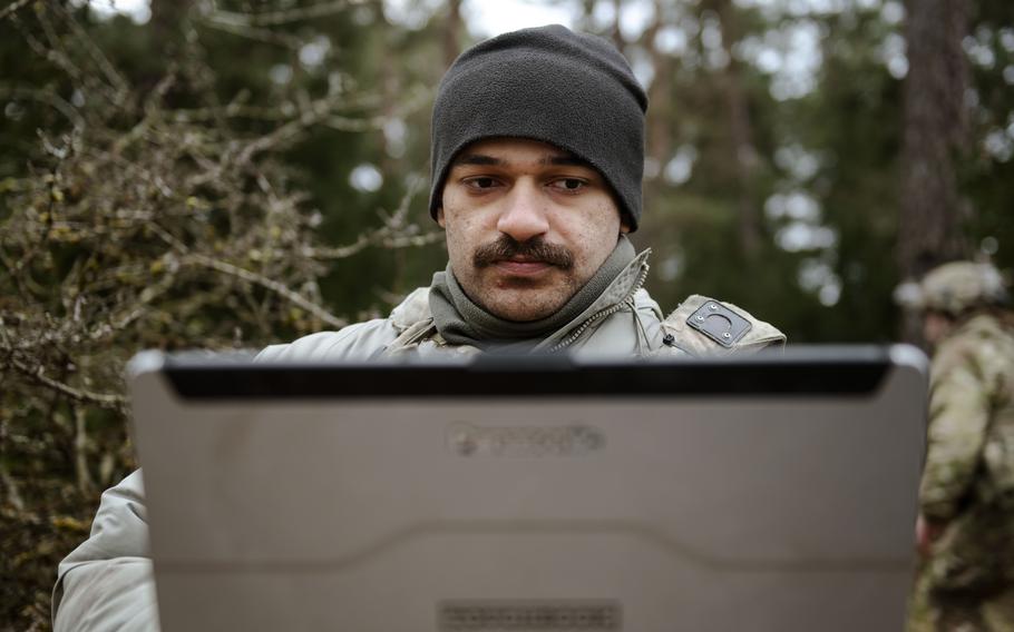 A U.S. soldier remotely pilots a Ghost reconnaissance drone.