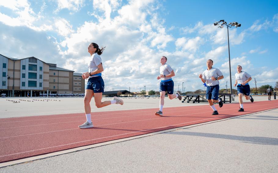 Trainee Anita Alvarez, 331st Training Squadron, leads from the front during the run portion of her official physical fitness test