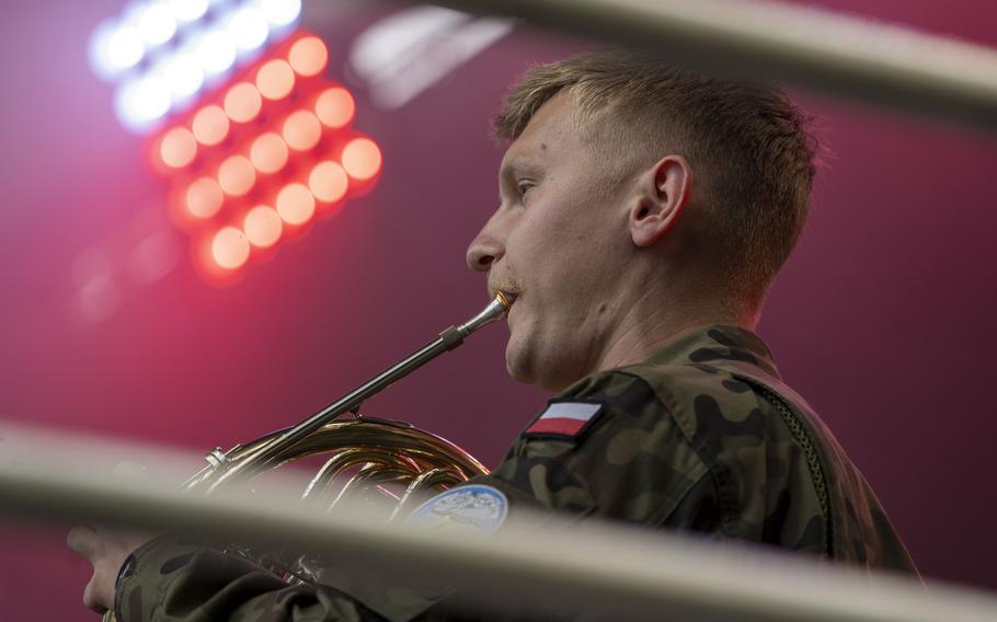 A Polish Air Force member plays the U.S. national anthem, signaling the start of the inaugural Polish-American Freedom Fest, held at Powidz Lake, Poland, July 4, 2024. 