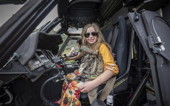 A young girl sits in the cockpit of a West Virginia National Guard helicopter during the 3rd annual Girls in Aviation Day.