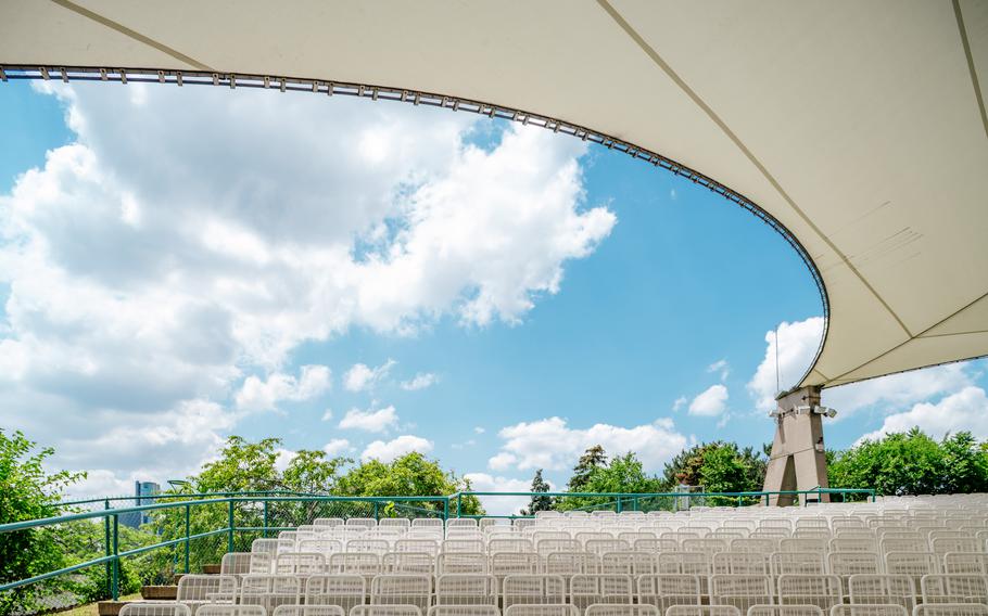 Seating inside the Aretha Franklin Amphitheatre. One of the top 100 concert venues in the world, this modern, open-air space underwent a major renovation in 2021, now accommodating 6,000 people and catering to those who wish to take in a concert from the comfort of their boat on the Detroit River.