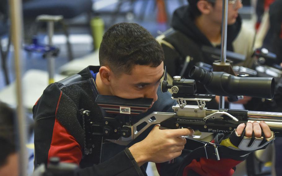 Alan Smith fires at a target.