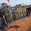 Airmen from Ramstein Air Base, Germany, join 86th Airlift Wing leaders and construction experts at a ceremonial shovel digging Jan. 24, 2025, to mark the beginning of construction the 37th Airlift Squadron's operations facility. Work on the $23 million project will take place over the next couple of years.