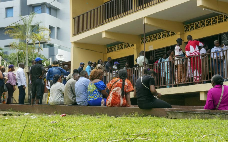 People lining up to vote outside of a building in the capital of Gabon, Libreville, on Nov. 16, 2024.