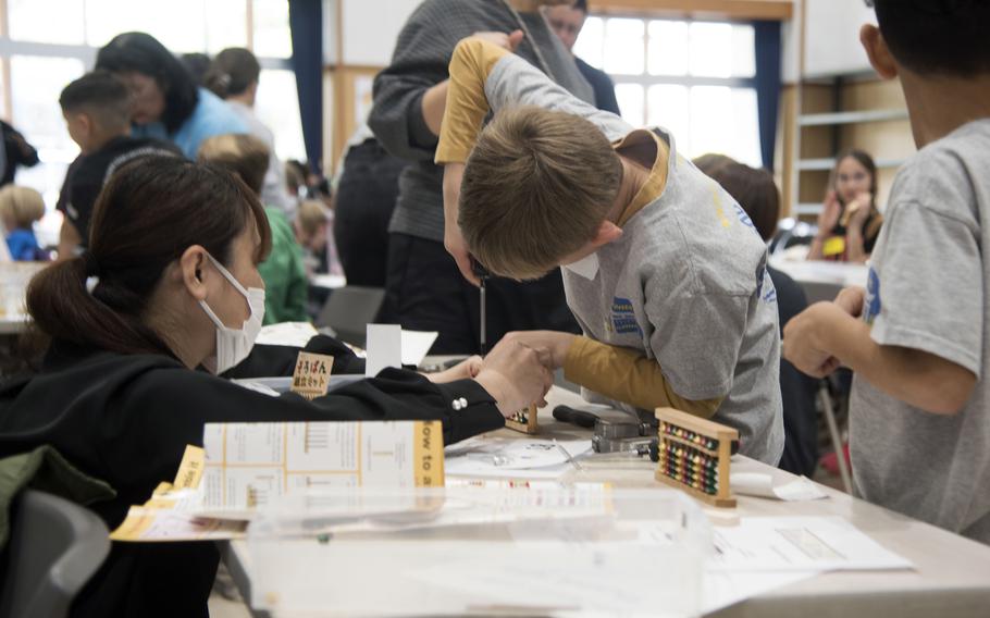 DODEA elementary students learn soroban, a Japanese math skill, in Okinawa, Japan. 