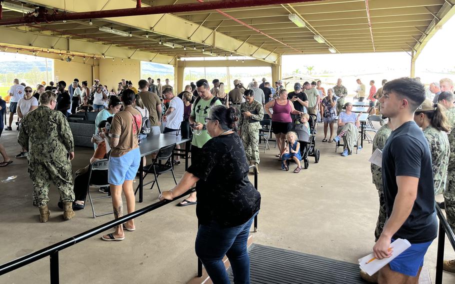 In the wake of Typhoon Mawar, people wait to apply for emergency aid from the Navy-Marine Corps Relief Society on Guam, June 2, 2023.