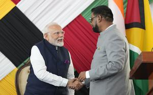 The prime minister of India, Narendra Modi, greets the president of Guyana, Mohammed Irfaan Ali, Nov. 20, 2024. 