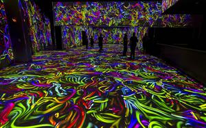 Projections of colorful cords cover the floor and walls at Electric Playhouse, a new high-tech social gaming place opening soon at The Forum Shops at Caesars on June 14, 2024, in Las Vegas. 