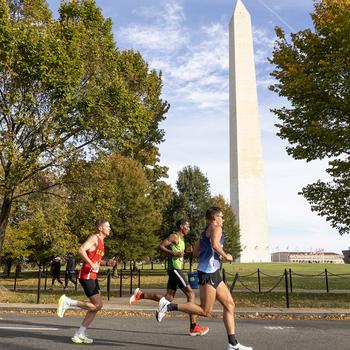 Kyle King, left, and runner-up George Crist, foreground, pass the Washington Monument 