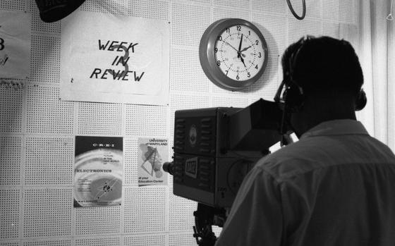 Incirlik Air Base, Turkey, Jul. 7, 1964: Cameraman A1C Andrew M. Davaca from Canton, Ohio, focuses on graphics to be used in AFTV Channel 3's programming. The solitary TV station in Turkey puts out a fove-minute news update every hour, a half hour newscast and sports show at 6 p.m., and another 15-minutes newscast at 10 p.m.

Looking for Stars and Stripes’ historic coverage? Subscribe to Stars and Stripes’ historic newspaper archive! We have digitized our 1948-1999 European and Pacific editions, as well as several of our WWII editions and made them available online through https://starsandstripes.newspaperarchive.com/

META TAGS: Europe; Asia; Eurasia; AFN; American Forces Network; television network; AFN personnel; entertainment; military; TV studio; TV camera; broadcast; TV; television; TV show; journalism; community; Armed Forces Network; radio