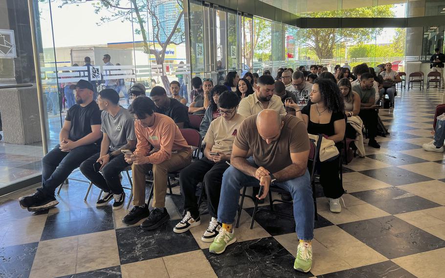 People wait at the Puerto Rico State Elections Commission