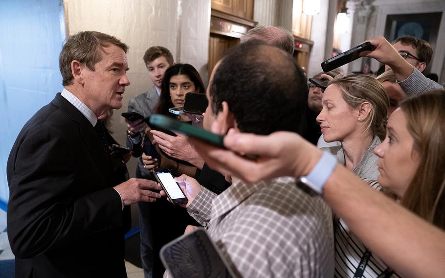 U.S. Sen. Michael Bennet, D-Colo., speaks with members of the media following passage of a short-term funding bill on Sept. 30, 2023, in Washington.