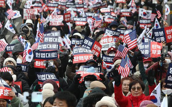 Supporters of impeached South Korean President Yoon Suk Yeol participate in an rally near the Constitutional Court on Jan. 21, 2025, in Seoul, South Korea. Impeached President Yoon Suk Yeol attended the hearing of his impeachment trial at the Constitutional Court to review evidence submitted by the National Assembly related to his short-lived imposition of martial law on Dec. 3. (Chung Sung-Jun/Getty Images/TNS)