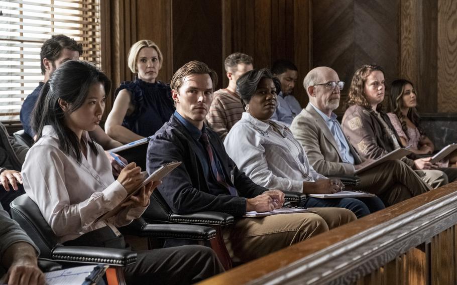 Leslie Bibb, top center, Chikako Fukuyama, from bottom left, Nicholas Hoult, Adrienne C. Moore, J.K. Simmons, Drew Scheid and Hedy Nasser in a scene from “Juror #2.”