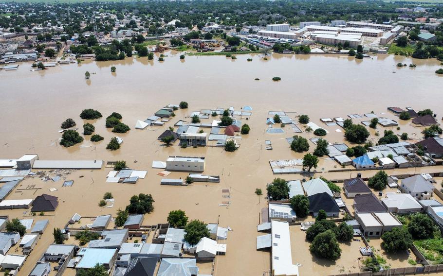 Houses are partially submerged following a dam collapse