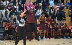 The Baumholder bench celebrates a basket that turned into a three-point play in the waning moments of the game as the Buccaneers beat Alconbury in OT 49-43 to take the boys Division III title at the DODEA-Europe basketball championships in Wiesbaden, Germany, Feb. 15, 2025. 