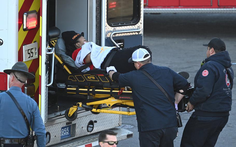 Medical personnel load a woman into an ambulance after a shooting at Union Station after the Kansas City Chiefs Super Bowl LVIII victory parade on Wednesday, Feb. 14, 2024, in Kansas City, Missouri. 