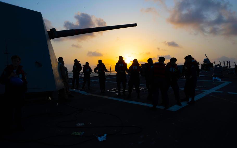 Sailors assigned to the USS Mason during a replenishment-at-sea with the Henry J. Kaiser-class fleet replenishment oiler USNS Kanawha in the Red Sea, Dec. 21, 2023.