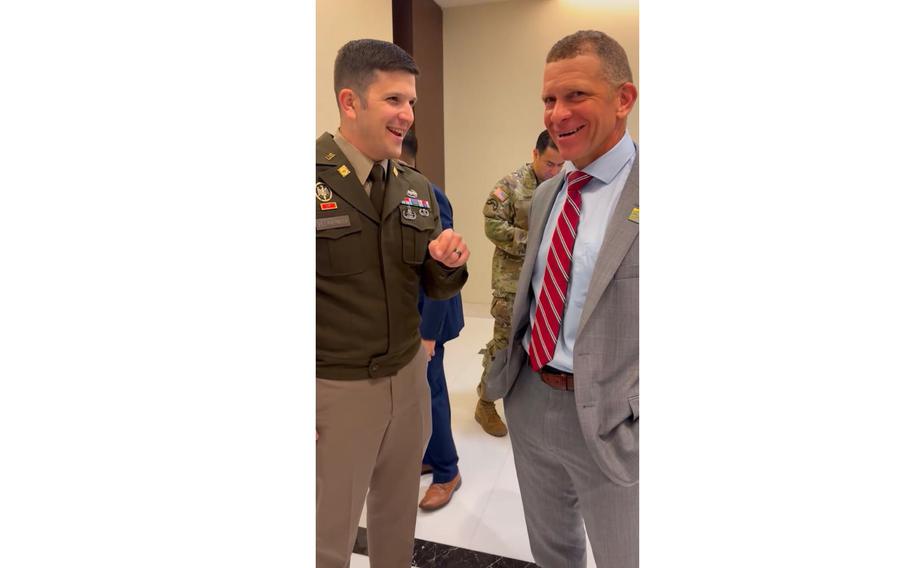 Soldier speaks with Tony Grinston.