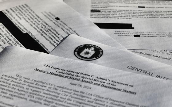 Documents related to the sexual assault case against CIA officer Donald Asquith are arranged for a photograph in New York on Tuesday, Sept. 10, 2024. (AP Photo/Patrick Sison)