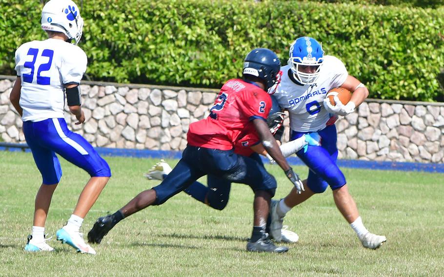 Rota's Daniel Guido tries to break a tackle during the Admirals' 44-0 loss to Aviano on Saturday, Sept. 23, 2023. 