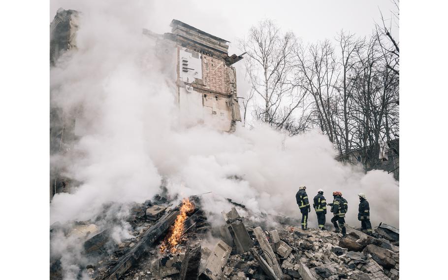 Rescue workers search for survivors after a missile strike that destroyed a residential building in Kharkiv, Ukraine, in January 2024. 