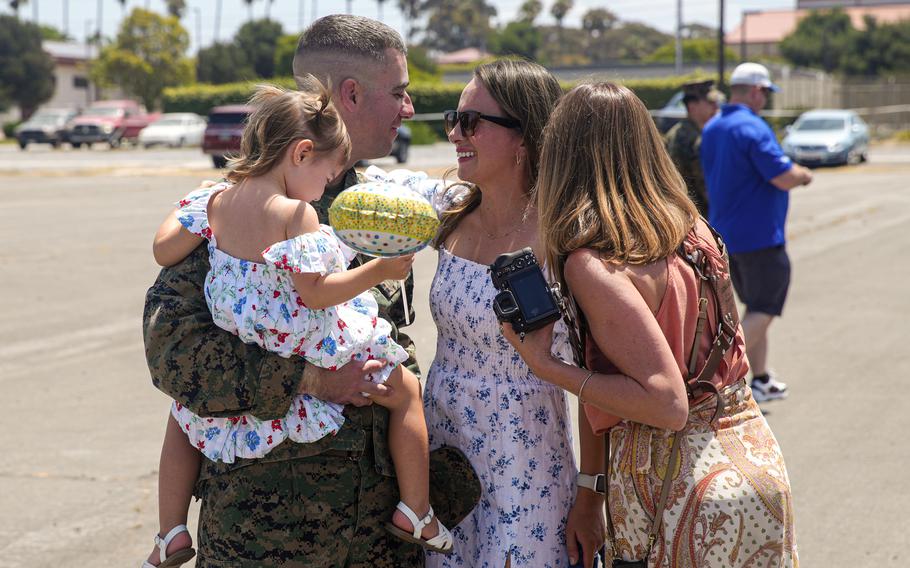 U.S. Marine Corps Maj. Peter Bose, the future operations officer assigned to the 15th Marine Expeditionary Unit, reunites with his family at a welcome home reception at Marine Corps Base Camp Pendleton, Calif., on Aug. 10, 2024. 