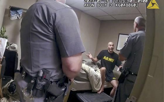 In this image taken from New York State Police body camera video that was obtained by WMTW-TV 8 in Portland, Maine, New York State Police interview Army reservist Robert Card, the man responsible for Maine's deadliest mass shooting, at Camp Smith, in Cortlandt, N.Y., July 16, 2023. 
